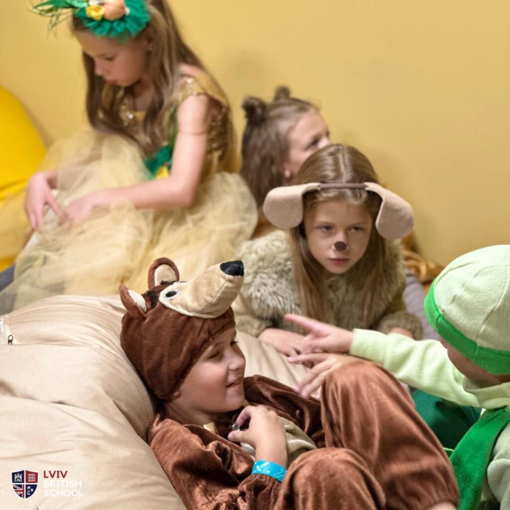 A boy and a girl dressed in puppies' costumes